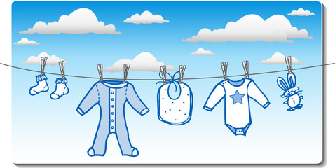 baby boy clothing on clothes line with clouds