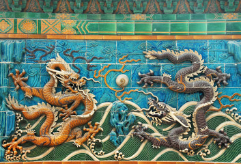 Fototapeta na wymiar dragon wall in Beihai park of Beijing,China