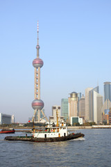 Naklejka premium Pudong skyline at sunset, Shanghai, China