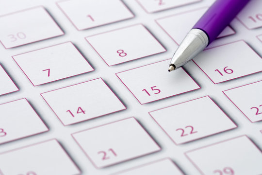 Purple Pen On Purple Calendar