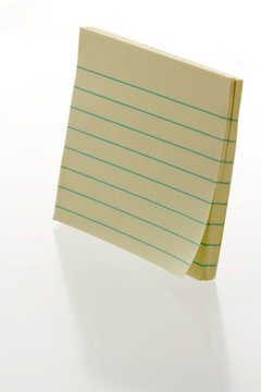 Yello notepad with lines - on shiny white background