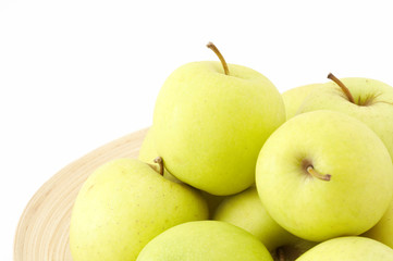 stack of apples on wooden plate