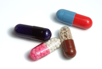 colored capsules on white