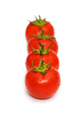 Four tomatoes isolated on the white background