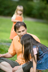 Man and daughters