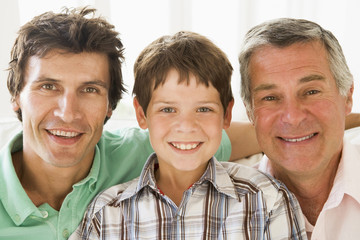 Grandfather with son and grandson smiling