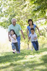 Grandparents running with grandchildren