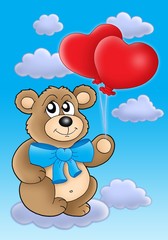 Teddy bear with heart balloons on blue sky
