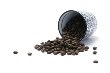 Cup and coffee beans - focus on beans