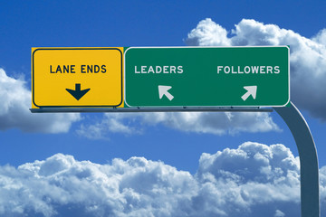 Freeway sign in blue cloudy skies reading Leaders and Followers