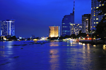Thailand night view of the city of Bangkok with the river