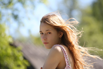 Naklejka premium teenager girl on windy day