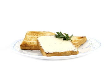 toast with butter on plate isolated on white background