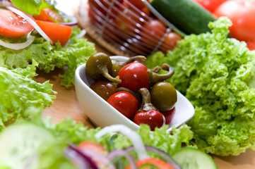Fresh salad with onion, tomato and basil