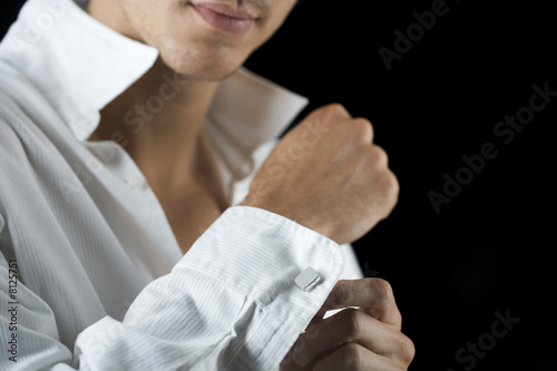 putting on a shirt