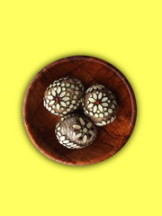 handmade Easter eggs at wooden plate