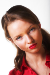 Portrait of beautiful young woman with red lipstick