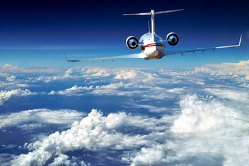 Luxury airplane above sky, clouds