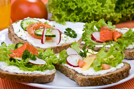 Whole grain bread, vegetables ,white cheese and salmon