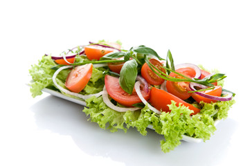 Fresh salad with onion, tomato and basil