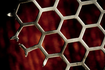 Metal Background hex pattern on red