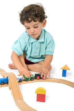 boy playing with train