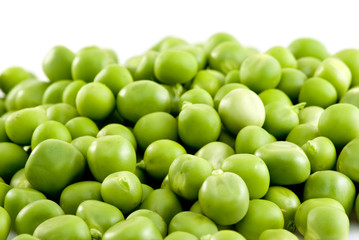 Pile of green peas isolated on the white background