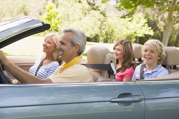 Family in convertible car