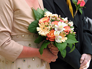Bride, groom and a wedding bouquet