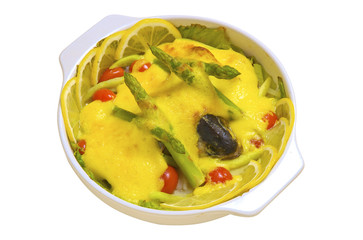 Baked pudding with the asparagus by lemon and the fish