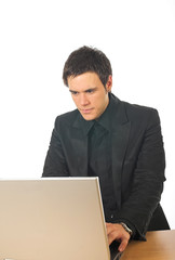 Young businessman working on laptop computer