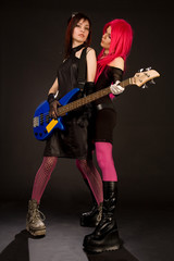 Fototapeta premium Two rock girls with bass guitar