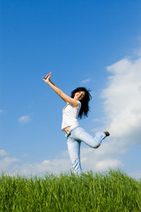 expressive young woman is jumping