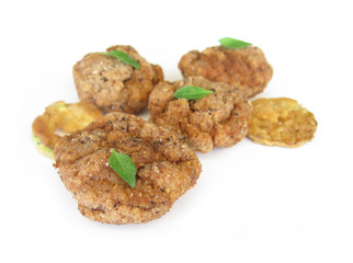 Meatballs with basil leaves