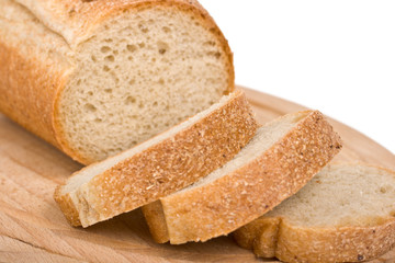 Sliced bread on wooden plate