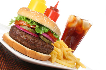 Hamburger served with french fries and soda angled
