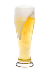 Foaming beer in a pilsner glass
