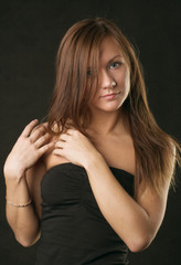 Fototapeta premium Young woman portrait, studio shot