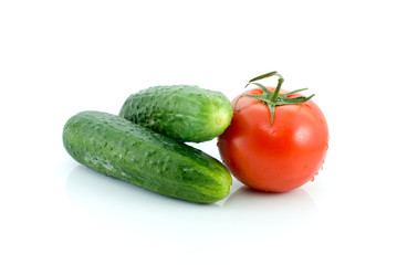 Single tomato and pair of cucumbers