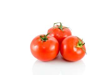 Three ripe red tomatoes