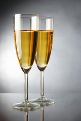 Champagne over grey background