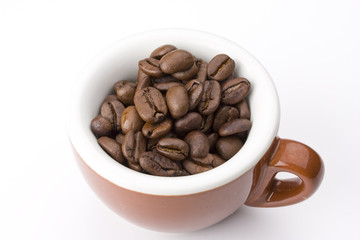 espresso cup, beans and details of the machinery