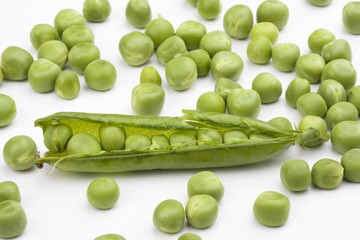 fresh green peas on a white background