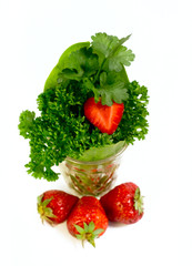 Strawberries and plants isolated on white