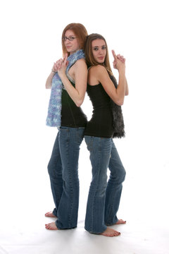 edgy looking teens with tight denim and fuzzy scarfs