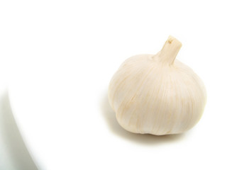 Garlic on white plate