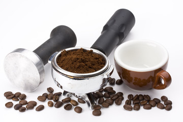 espresso cup, beans and details of the machinery