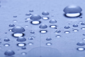  	Water drops on a glass surface