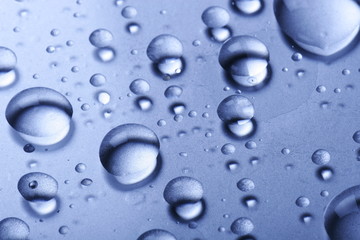  	Water drops on a glass surface
