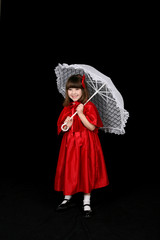 Girl in red holding white parasol